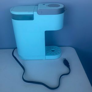 Mint colored mini Keurig. Perfect condition, not imperfections. Used shortly.
